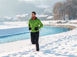 man jogging in the snow