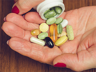 dietary supplements in womans hand