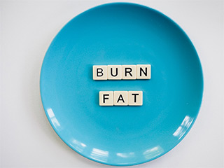 scrabble letters spelling burn fat