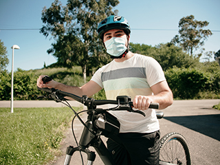 bicyclist outside with mask