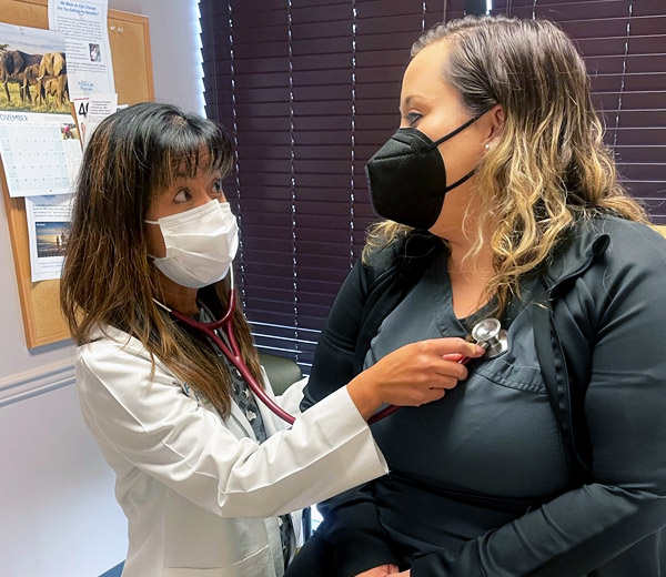 A doctor smiling with a patient.